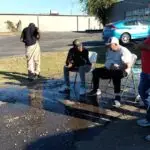 “Pastor Chris Bacon preaching at a revival service.”